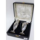 George V silver sugar castor and matching cream jug, Birmingham 1933, in fitted box, tallest 21cm