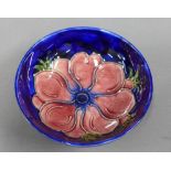 Moorcroft anemone pattern bowl with blue glazed ground, 11cm diameter