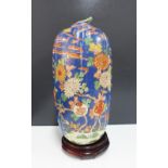 Japanese jar and cover of lobed form, blue ground painted with cockerels, flowers and foliage,