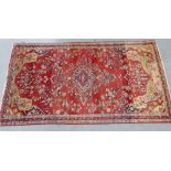 Persian rug, with central medallion and foliate field with beige spandrels, 300 x 166cm
