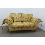 Parker & Farr two seater sofa, modern, upholstered in gold fabric with a striped base and floral