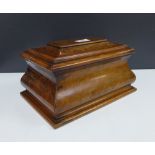 Walnut tea caddy of ogee form, hinged lid opening to reveal a satin birch interior and two