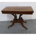 Regency rosewood table, the foldover top with a beaded edge and green felt interior, raised on