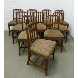 Set of eleven Sheraton style mahogany chairs with splat backs carved with triple wheat ears, stuff