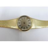 Lady's vintage 9ct gold Eterna wrist watch on a textured 9ct gold bracelet strap