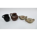 Two Greek 'Olpe' jugs and two small oil lamps, tallest 7cm (4)