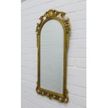 Rococo style faux gilt wall mirror, 82 x 39cm