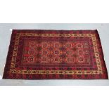 Persian wool rug, 20th century, North West Iran, red field with fifteen guls and multiple
