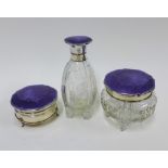 George V silver and enamel mounted glass dressing table set comprising a bottle, powder jar and