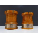 Two Mauchline style fruitwood turrets with castellated rims and white metal bands one inscribed '