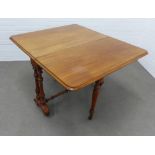 Victorian mahogany Sutherland table, with twin side supports and turned legs, terminating on brass