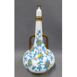 Royal Worcester lobbed vase and cover, with side handles, painted with gilded flowers and