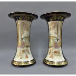 Pair of Japanese Satsuma vases, each with a flared rim and painted with a pattern of figures and