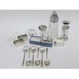 Four silver napkin rings with mixed hallmarks, an Epns napkin ring, set of six silver teaspoons,