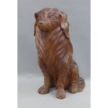 Carved wood model of a seated dog, 43cm