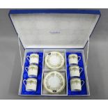 Cased Aynsley bone china set of six demi tasse cups and saucers (one cup a/f)