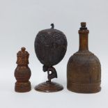 Carved fruitwood castor, carved coconut goblet on figural stem and a wooden mallet, tallest 18cm (3)