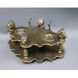 Austrian brass desk set, formed as two plates supported between baluster pillars, each with a turban