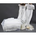 A large collection of antique and vintage christening gowns, under garments and lace trim etc (a