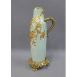 Royal Worcester porcelain ewer, celadon ground with crane and prunus pattern in gilt relief,