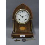 Mahogany and satin inlaid mantle clock, arched case with paterae, enamel dial with Arabic
