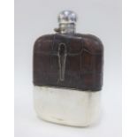 Late 19th / early 20th century silver plated and leather mounted clear glass hip flask, 18cm