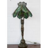 Art deco style figural bronze table lamp, with a Tiffany style shade 98cm tall