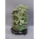 Jade carved sculpture on hardwood stand, 19cm