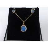 9ct gold opal and diamond pendant on a 9ct gold chain together with matching 9ct gold earrings (2)