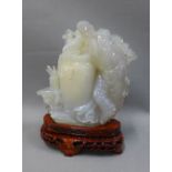 Jadeite carving of an Immortal figure, on wooden stand, 12cm