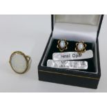 9ct gold opal dress ring, size N, and a pair of 9ct gold opal stud earrings (2)