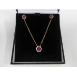 9ct gold ruby and diamond pendant on a 9ct gold chain together with a pair of 9ct gold ruby and