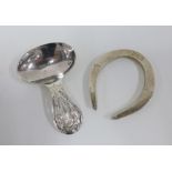 Silver horseshoe, Edinburgh 1960 , 5.5cm and a white metal thistle caddy spoon (2)