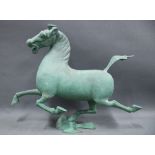 The Eastern Han Bronze Galloping Horse, 33cm high, in a fitted case