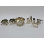 Collection of silver condiments with mixed hallmarks to include salts, pepper pots and a mustard