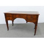 Burr walnut desk, rectangular top with faux leather skiver over an arrangement of five drawers,