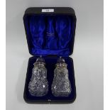 Edwardian glass and silver mounted pair of sugar castors, Walker & Hall Sheffield 1903, in fitted