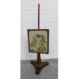 19th century mahogany pole screen with tapestry panel, on a platform base. 109 x 37cm