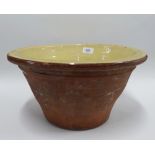 Yellow glazed terracotta mixing bowl, 38cm