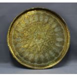 Brass engraved tray, of large circular form, 59cm