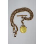 Queen Victoria 1863 sovereign in a pendant mount, on a 9ct gold Albert watch chain
