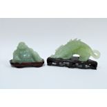 Carved jade dragon and a jade Buddha, both with wooden bases (2) 17cm