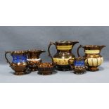 Collection of copper lustre jugs and bowls, (6) 17cm