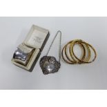 Birmingham silver napkin ring. Epns decanter label and four gold plated bangles (6)