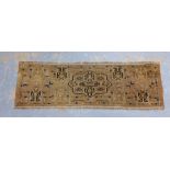 Small Eastern rug / mat , with a faded red field, 140 x 43cm