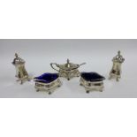 George V silver five piece condiment set comprising two pepper pots, two open salts and a mustard,