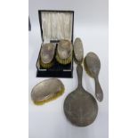 Early 20th century Birmingham silver three piece dressing table brush set and a three silver