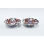 Pair of Chinese / Japanese porcelain bowls, painted with chrysanthemums on a circular blue and white