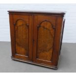 19th century mahogany and burrwood two door cupboard, the interior with four short drawers and a