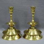 A pair of brass candlesticks of unusual form, (2) 21cm